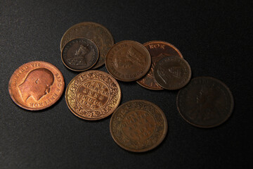 Old coins of India on black background