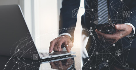 Business man using digital tablet and laptop computer working remotely, global business, telecommuting, internet technology