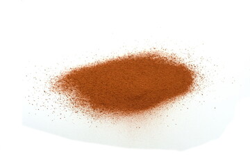 Pile of Red dirt (soil) on white. Heap of Red dry clay isolated on white background. Ochre, also spelled ocher, a natural yellow earth pigment.