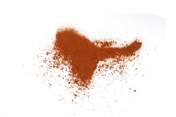 Pile of Red dirt (soil) on white. Heap of Red dry clay isolated on white background. Ochre, also...