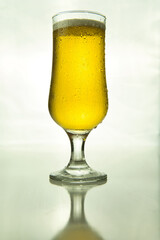 illuminated beer glass on white background