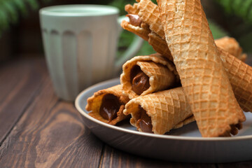 Wafer rolls with condensed milk. Thin and Crispy Waffle. Selective focus