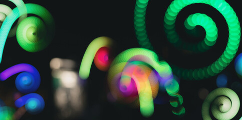 Spot colored lights on a black background, abstract background.