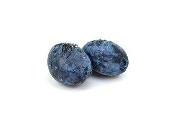 Plums with drops isolated on white. Plums with water drops. File contains clipping path.