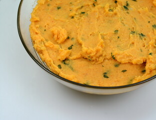 Mashed sweet potato isolated. Sweetpotato puree, batata mash, Ipomoea batatas spread, sweet potatoes smoothie, orange vegetable hummus on white background