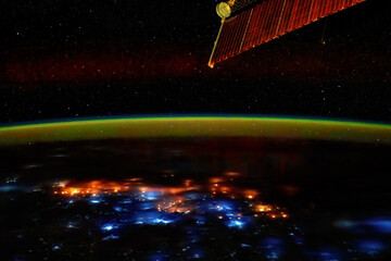 Thunderstorms at night seen from outer space. Elements of this image furnished by NASA
