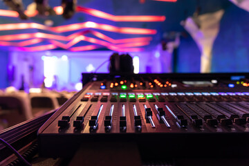 Close up, sound music mixer control panel on blurred background.