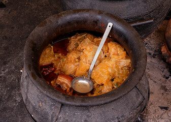 Sour cabbage cooked in earthenware pots