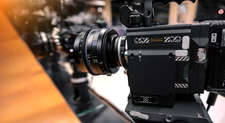 Digital Cinema camera and Cinema Lens. Manual interchangeable lens for filming. Shooting in the...