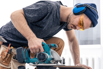 Circular Saw, carpenter using a circular saw for wood.