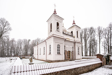 Old historical catholic church in winter day, Kurmene, Latvia