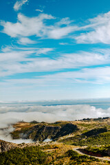 Fototapeta na wymiar Madeira - landscape blue sky, white clouds, road to Pico Areiro