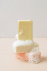 A bar of organic handmade soap with large bubbles of foam. Health beauty natural products concept. Organic cosmetics.