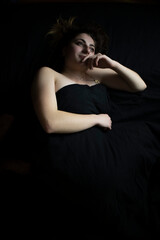 Fototapeta premium Girl on a black background