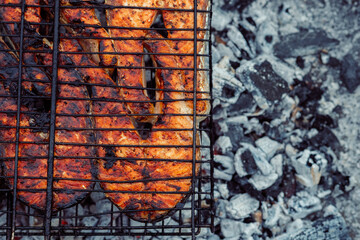 cooking fish outdoors barbecue close-up charcoal meal