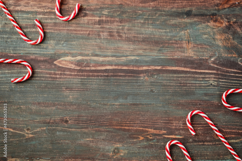 Poster group of candy cane on rustic table top view background