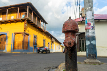 Old fire hydrant in the street of the colonial city of León, Nicaragua, Central America, Latin...