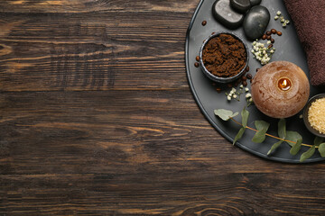 Beautiful spa composition with burning candle on dark wooden background