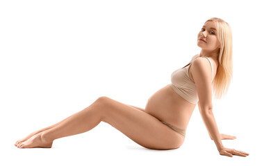 Beautiful pregnant woman on white background