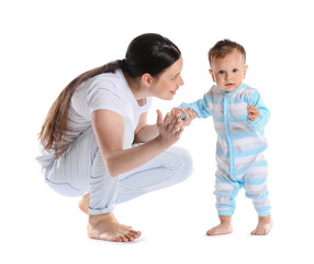 Little baby boy learning to walk with his mother on white background