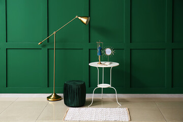 Modern interior with table, floor lamp and pouf