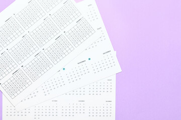 Classic calendars for 2022 year on color background, closeup