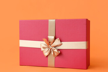 Christmas gift box on color background