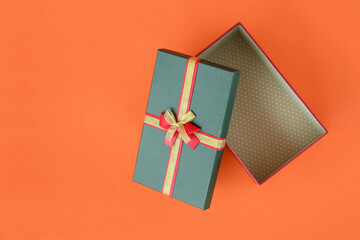 Christmas gift box on color background