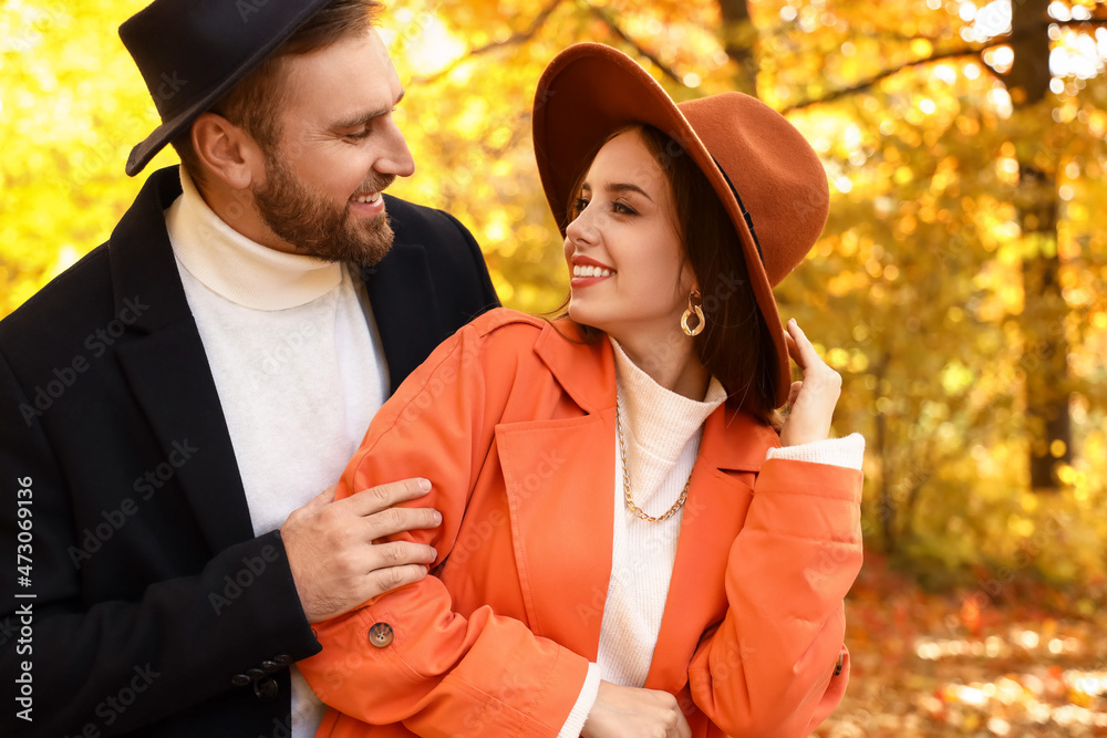 Poster Young loving people looking at each other in autumn park