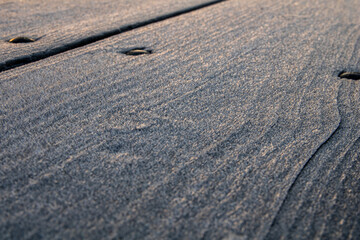 close up of frost on a wooden table