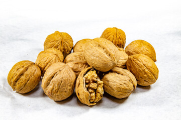 Walnuts (Juglans regia L) group isolated on white background in selective focus