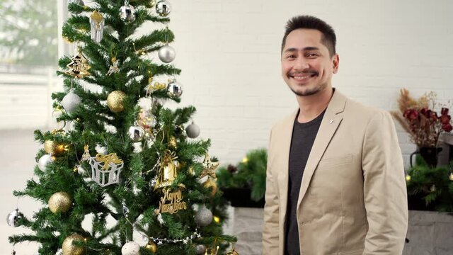 Young asian man hum with happiness on Christmas and new year celebration, holiday concept.