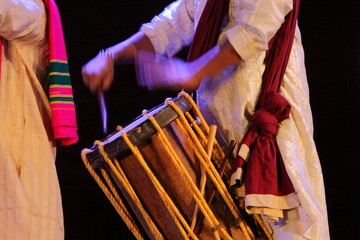 Close up of hand playing Indian musical instrument