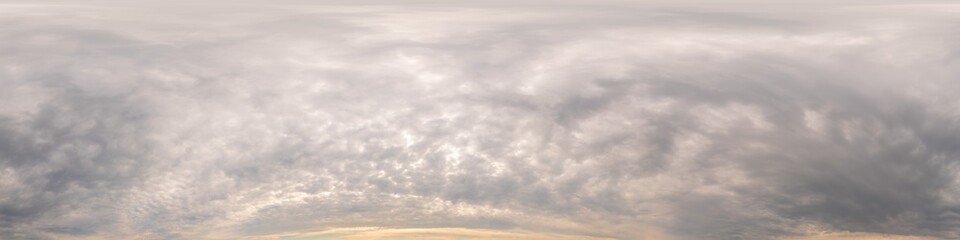 Overcast sunset sky pano with Cumulus clouds. Seamless hdr panorama in spherical equirectangular...