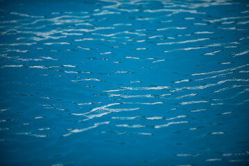 Fototapeta na wymiar Water in swimming pool, background with high resolution. Wave abstract or rippled water texture.