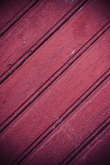 Background of diagonal red boards. Wooden background