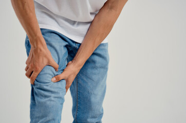man holding his knee pain injury health problems