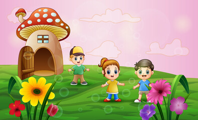 Obraz na płótnie Canvas Mushroom house with children playing in the field