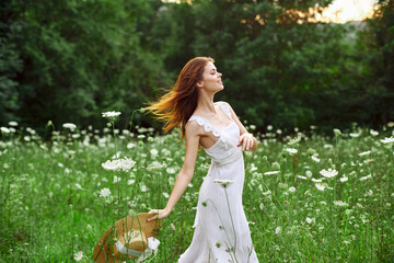 cheerful woman in a field outdoors flowers fresh air freedom