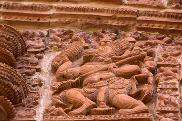Terracotta Temple Wall : Beautiful terracotta carving scenes of Ramayana and Mahavarat on the walls of ancient Hindu Terracotta Temple at Guptipara Brindaban Chandra's Math, India.