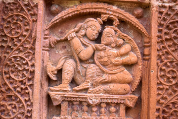Terracotta Temple Wall : Beautiful terracotta carving scenes of Ramayana and Mahavarat on the walls of ancient Hindu Terracotta Temple at Guptipara Brindaban Chandra's Math, India.