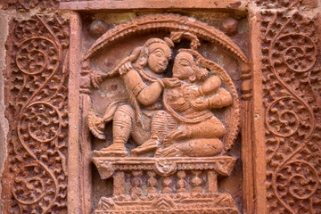 Terracotta Temple Wall : Beautiful terracotta carving scenes of Ramayana and Mahavarat on the walls of ancient Hindu Terracotta Temple at Guptipara Brindaban Chandra's Math, India.