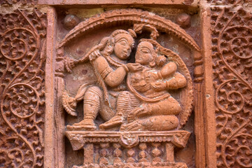 Terracotta Temple Wall : Beautiful terracotta carving scenes of Ramayana and Mahavarat on the walls of ancient Hindu Terracotta Temple at Guptipara Brindaban Chandra's Math, India.