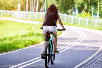 Cyclist ride on the bike path in the city Park
