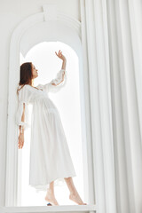 Woman in white dress posing fashion luxury