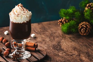 Hot milk chocolate with whipped cream. Winter and autumn warming drink. Copy space
