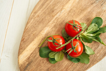 cherry tomatoes lettuce leaves wooden board fresh food