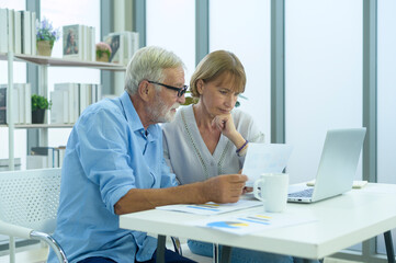 Caucasian senior Business people working and brainstorming in modern office