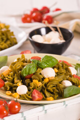 Fusilli pasta with cherry tomatoes and sweet corn.