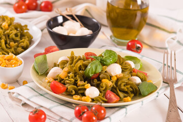 Fusilli pasta with cherry tomatoes and sweet corn.